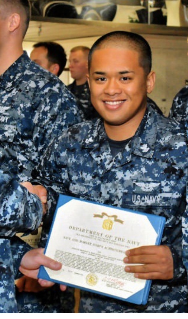 Navy veteran Joel and crew in service uniform